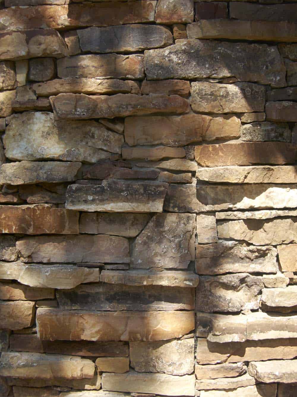 rustic craftsman-style lake house exterior stone detail