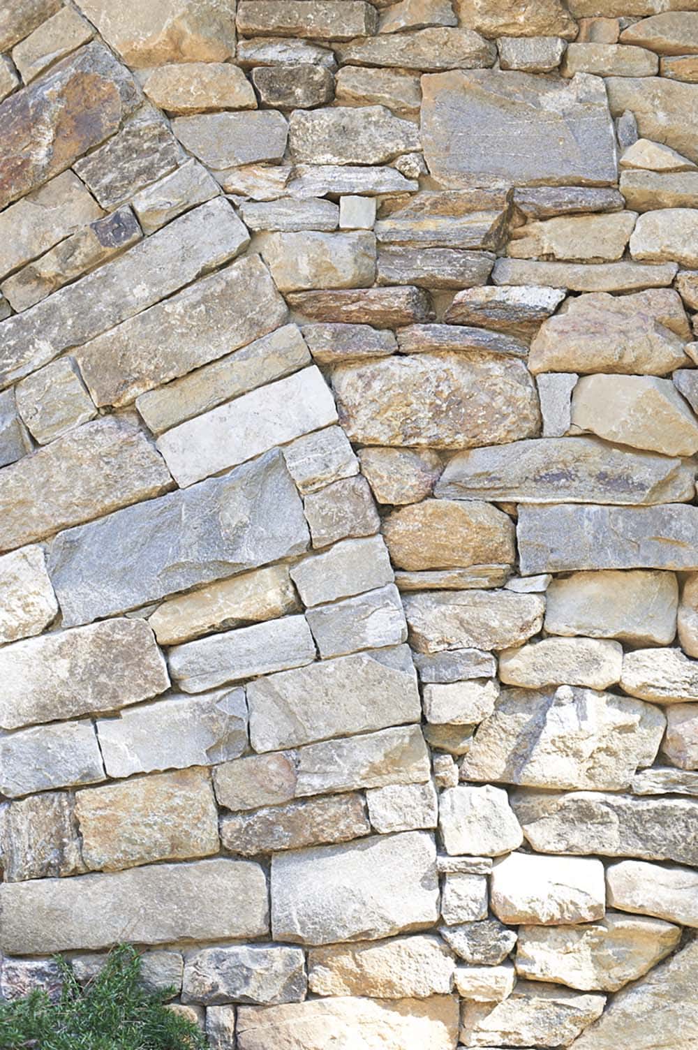 rustic craftsman-style lake house exterior stone detail