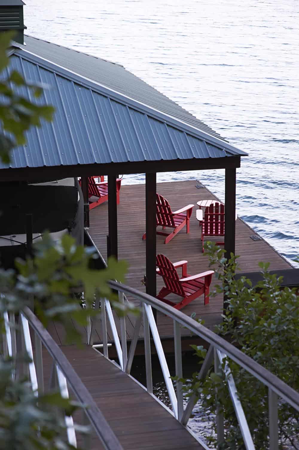 rustic craftsman-style lake house exterior backyard view