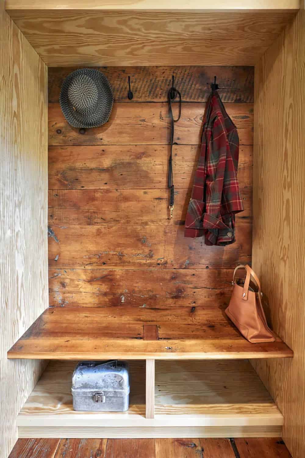 rustic modern mudroom with a built-in bench