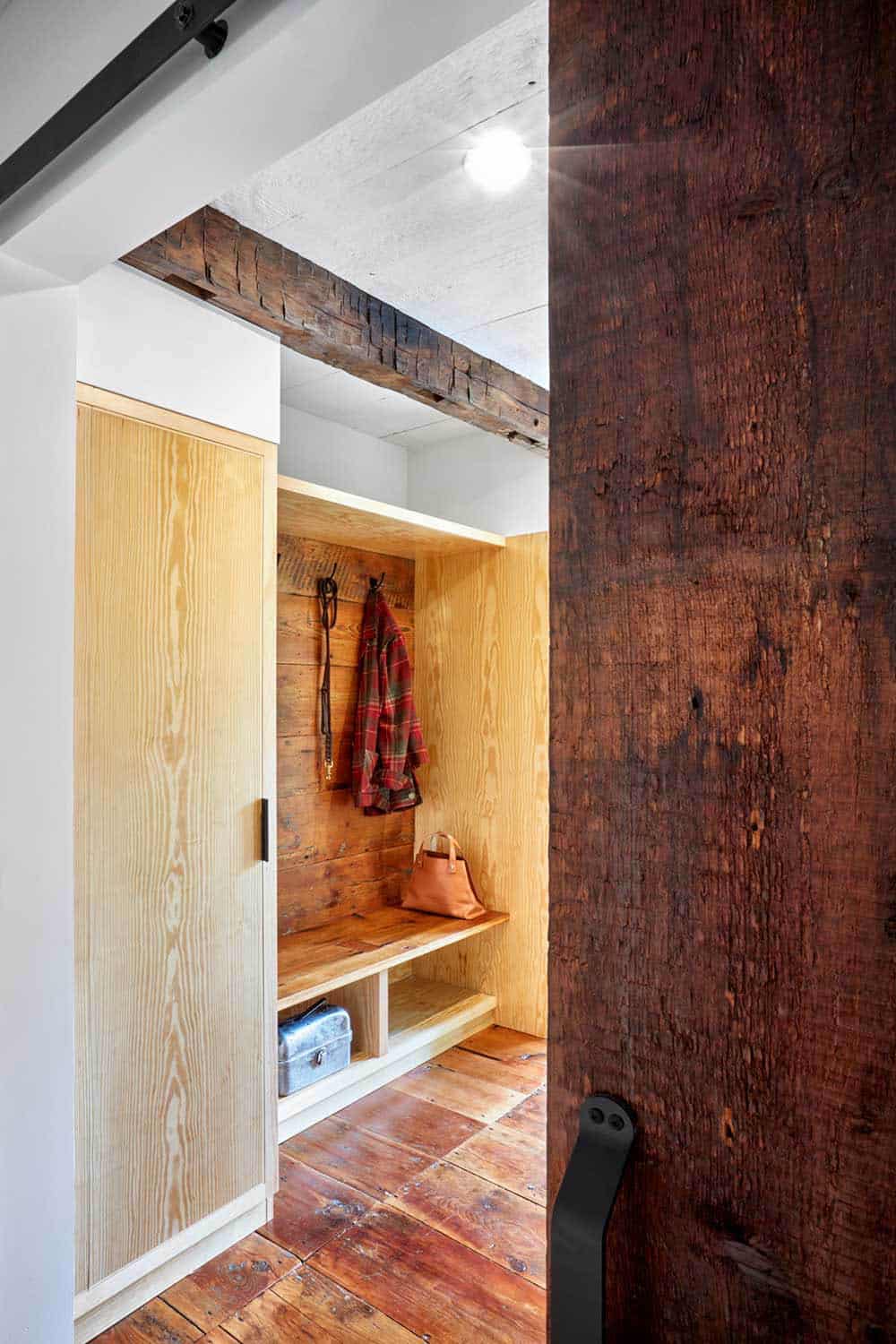 rustic modern mudroom with a built-in bench