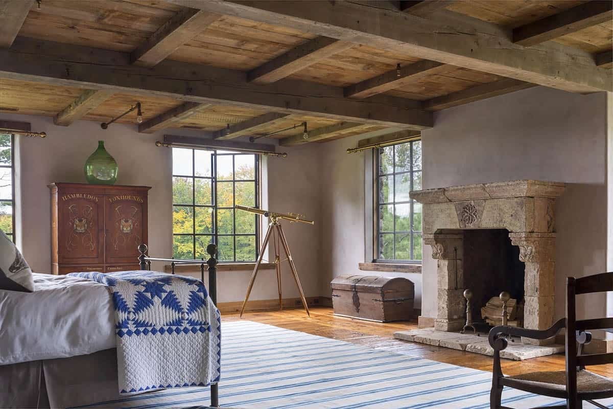rustic bedroom with a fireplace