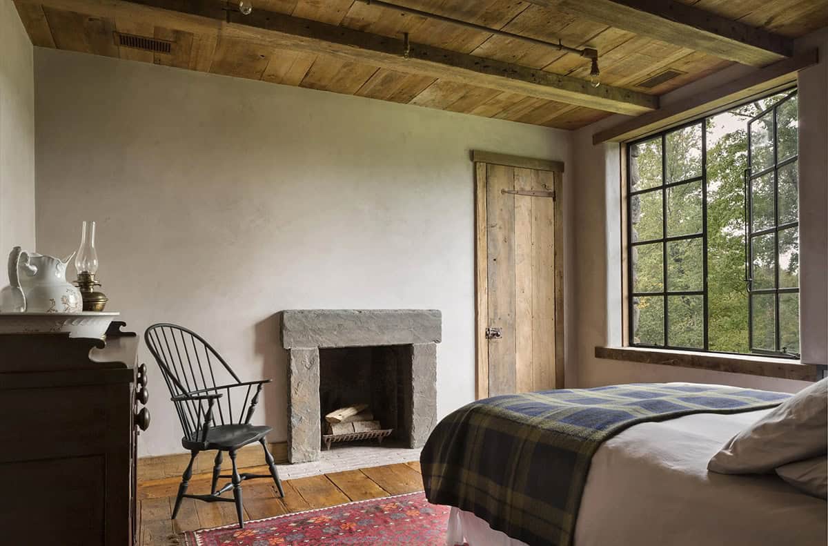 rustic bedroom with a fireplace