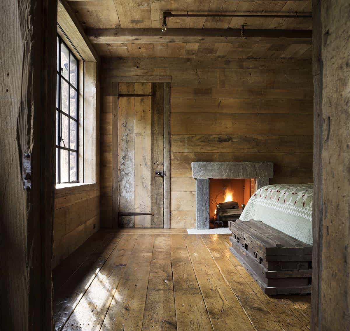 rustic bedroom with a fireplace