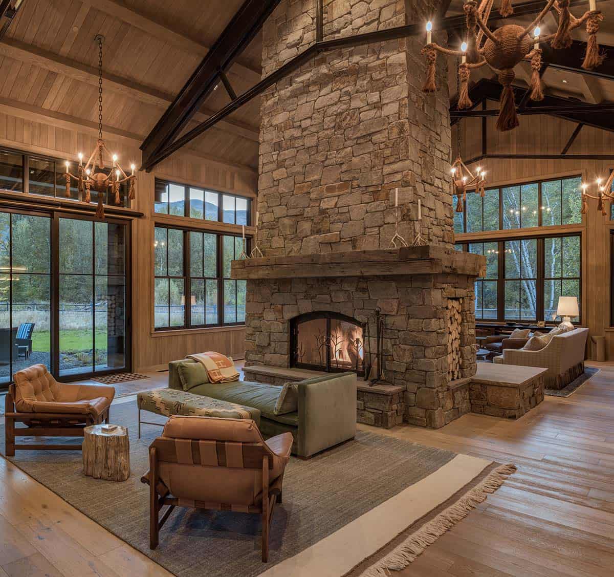 rustic great room with a dual-sided fireplace