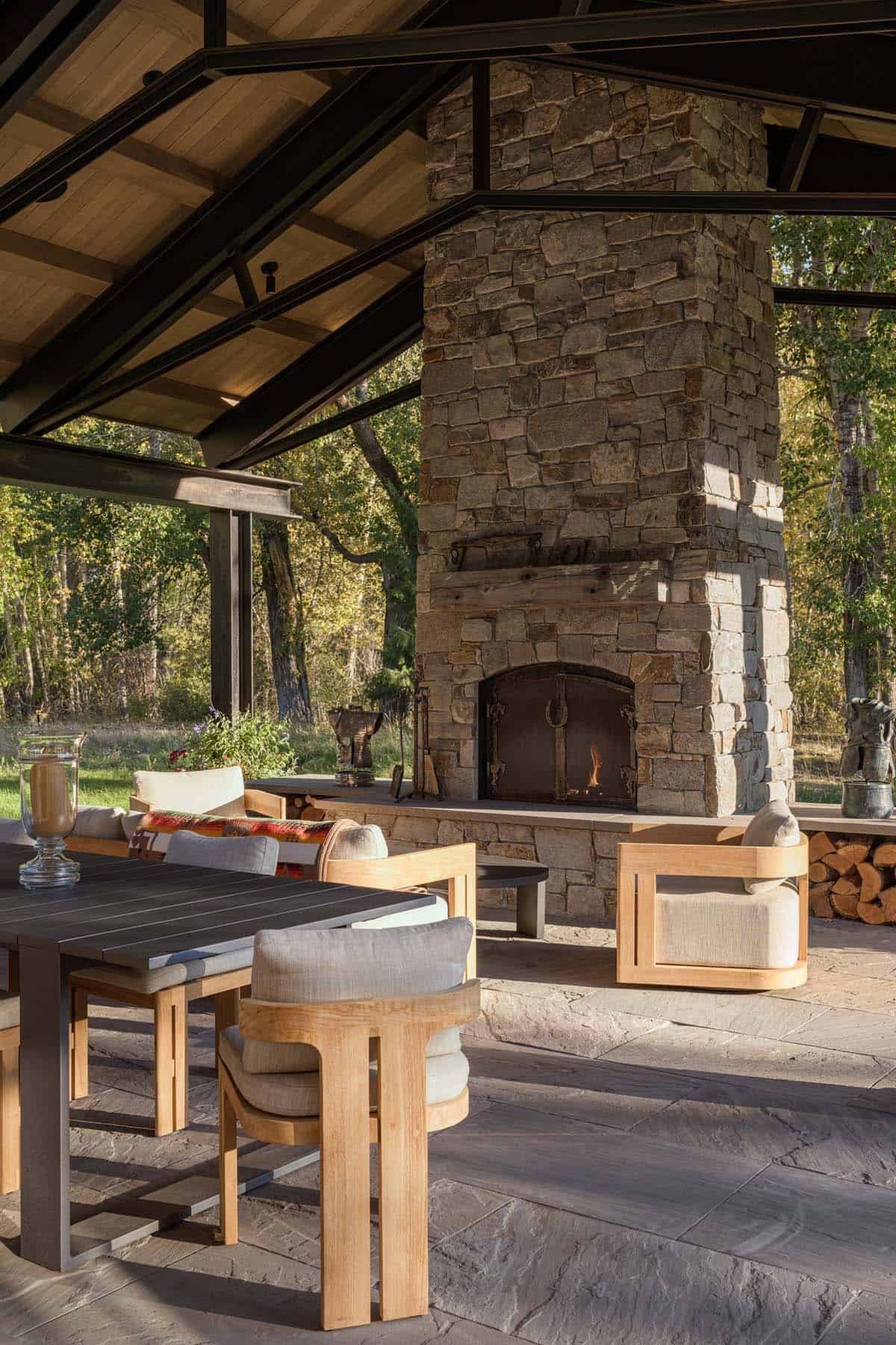 ranch house covered patio with a fireplace