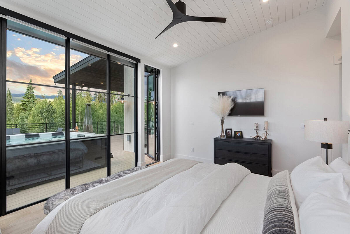 scandinavian modern bedroom with sliding glass doors