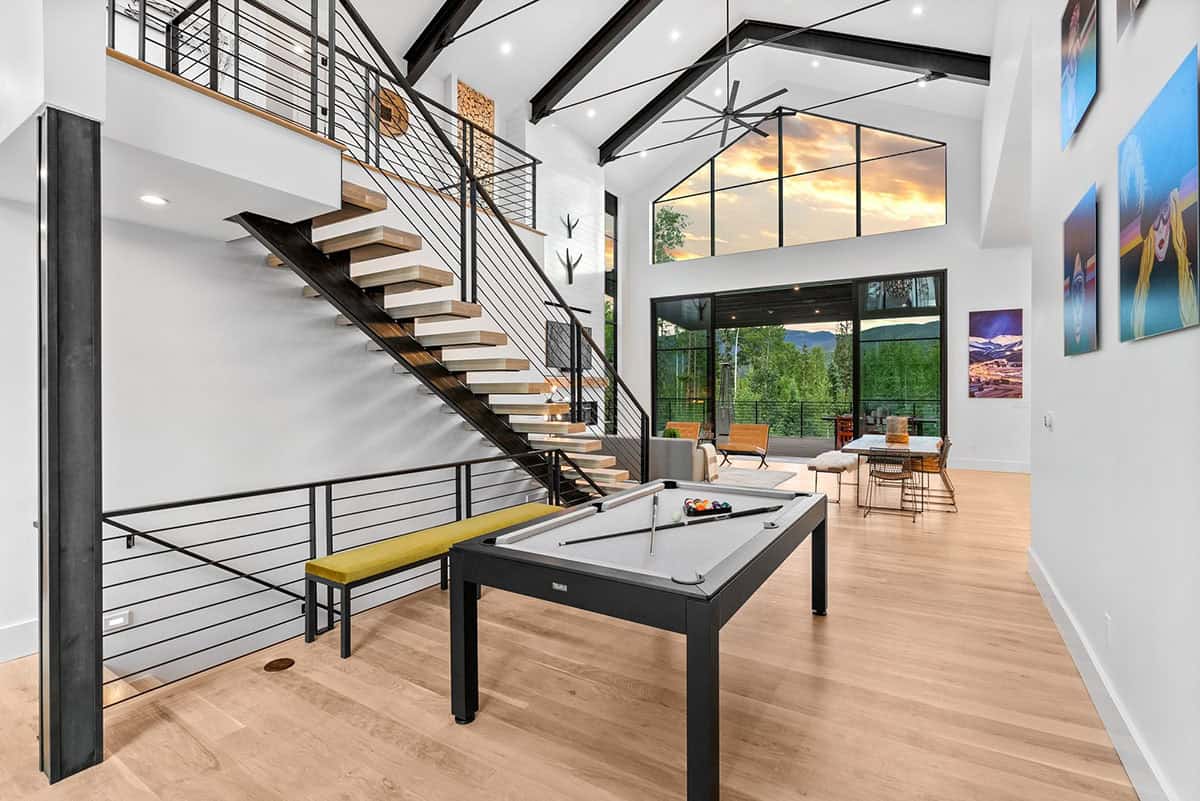 scandinavian modern living room with a pool table