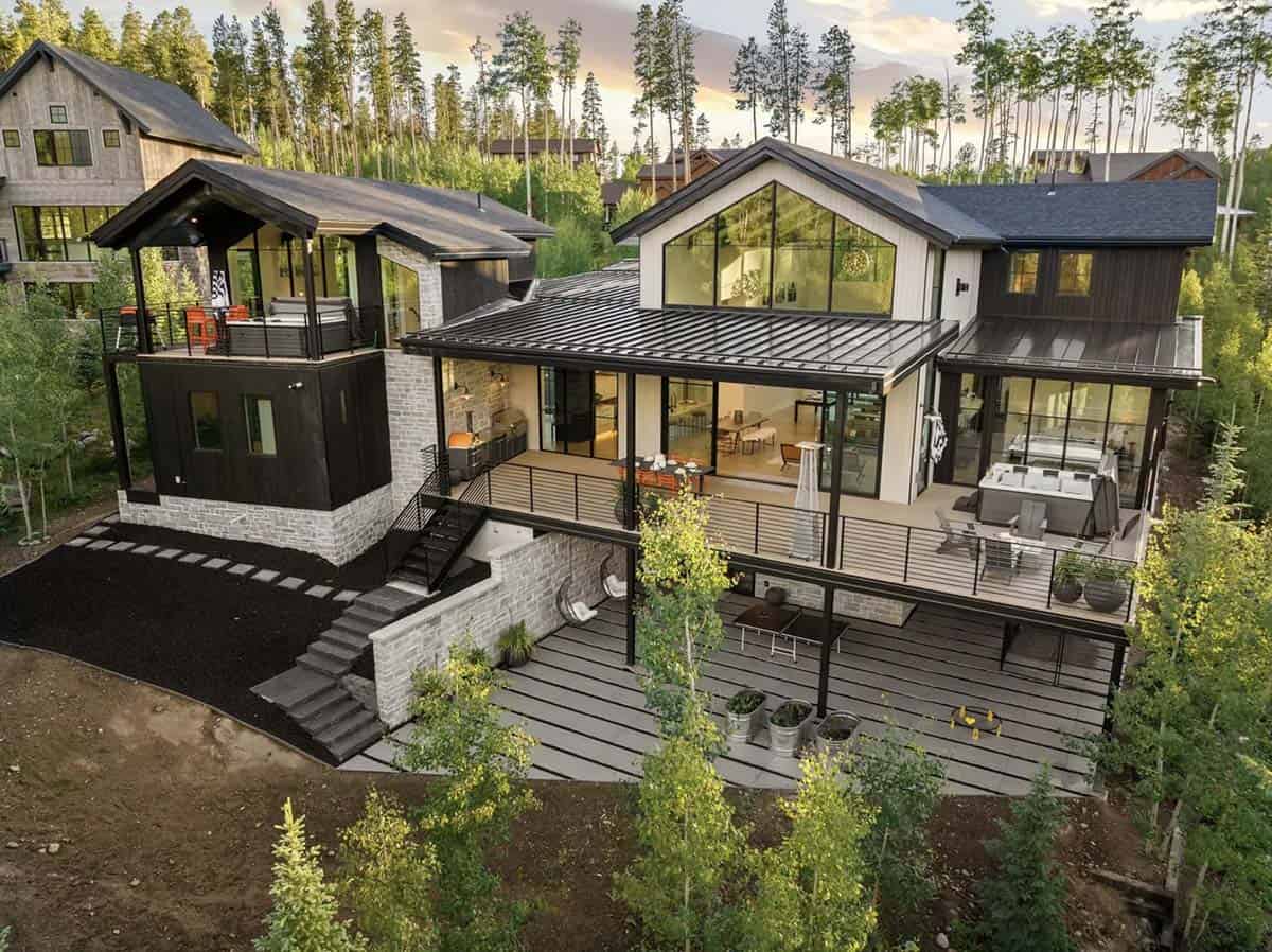scandinavian mountain home exterior backyard view