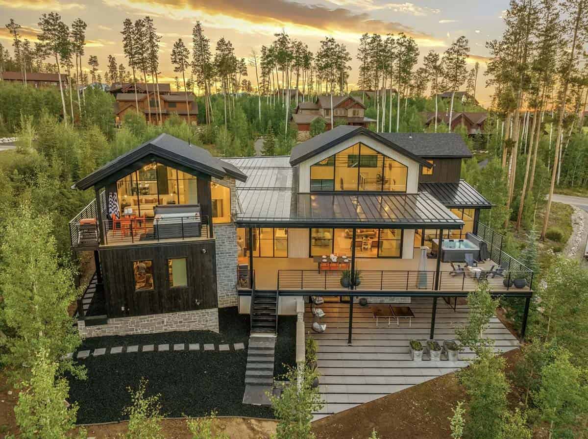 scandinavian mountain home exterior backyard view