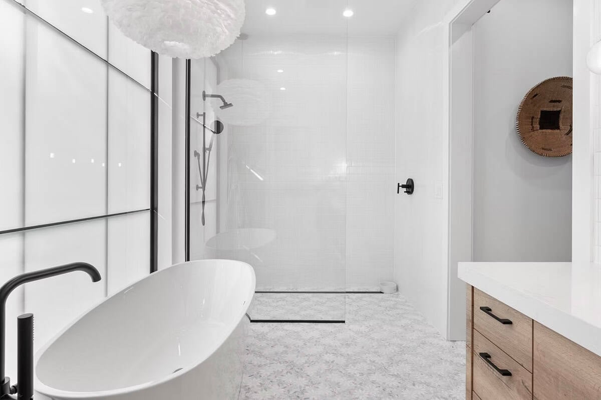 scandinavian modern bathroom with a freestanding tub and shower