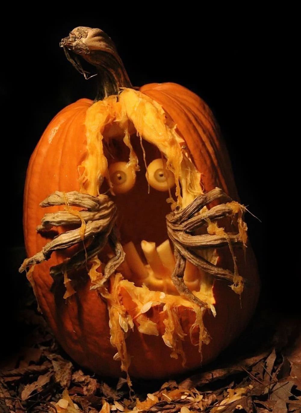 pumpkin with bendable hands opening the face