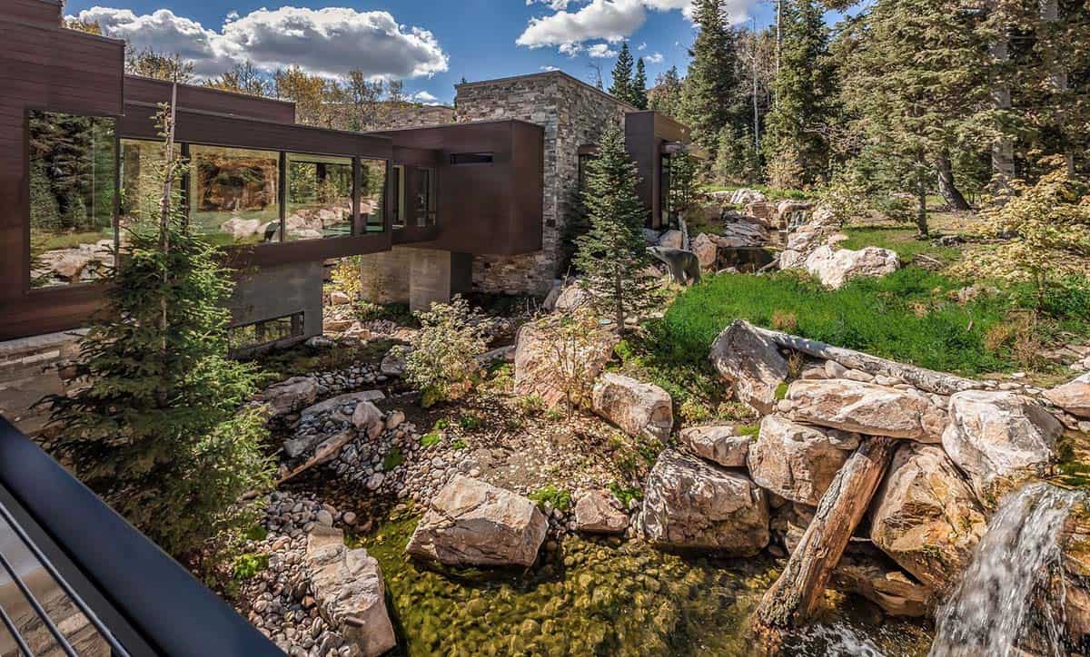 contemporary home exterior with a water feature