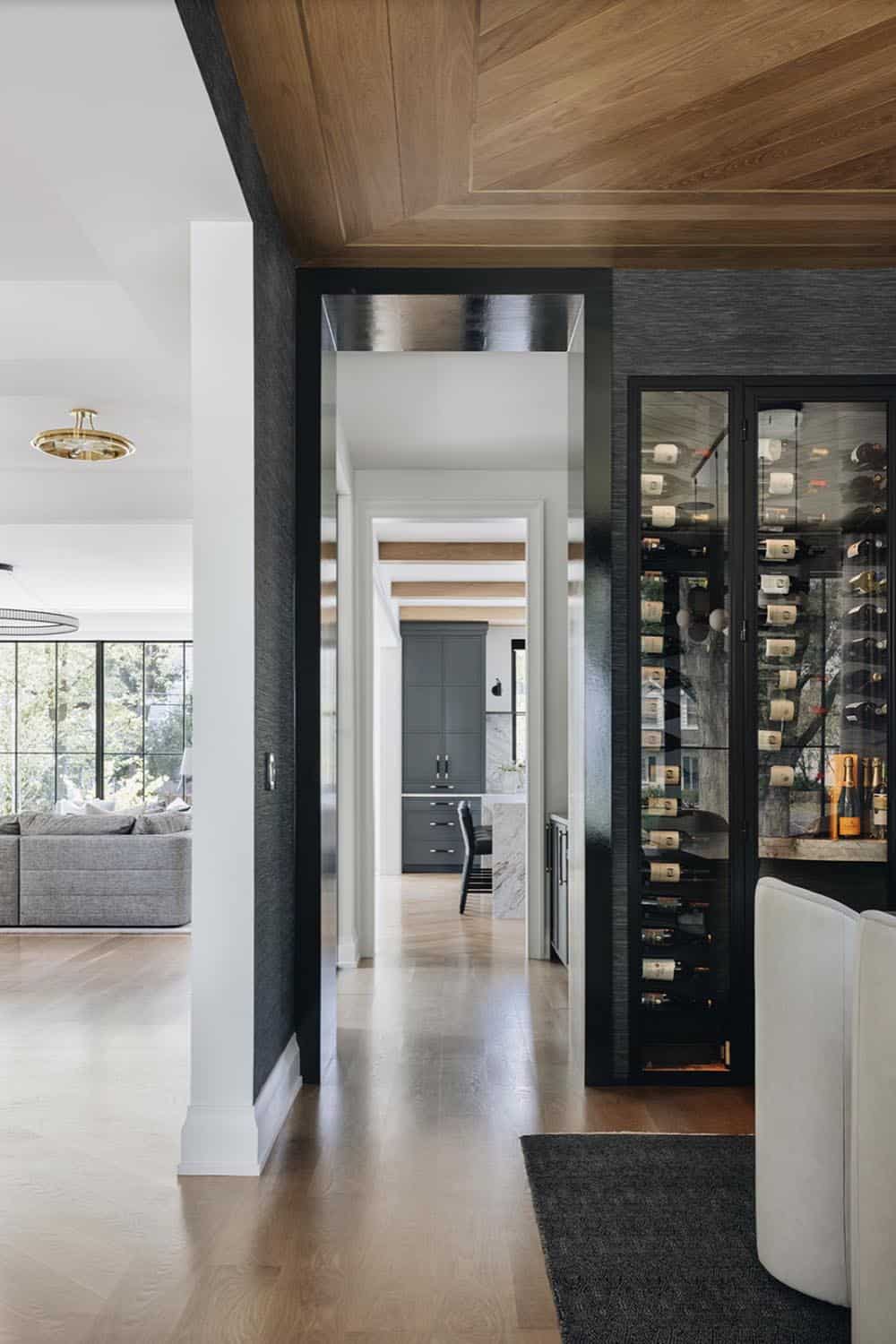 Transitional Style Dining Room with a wine wall