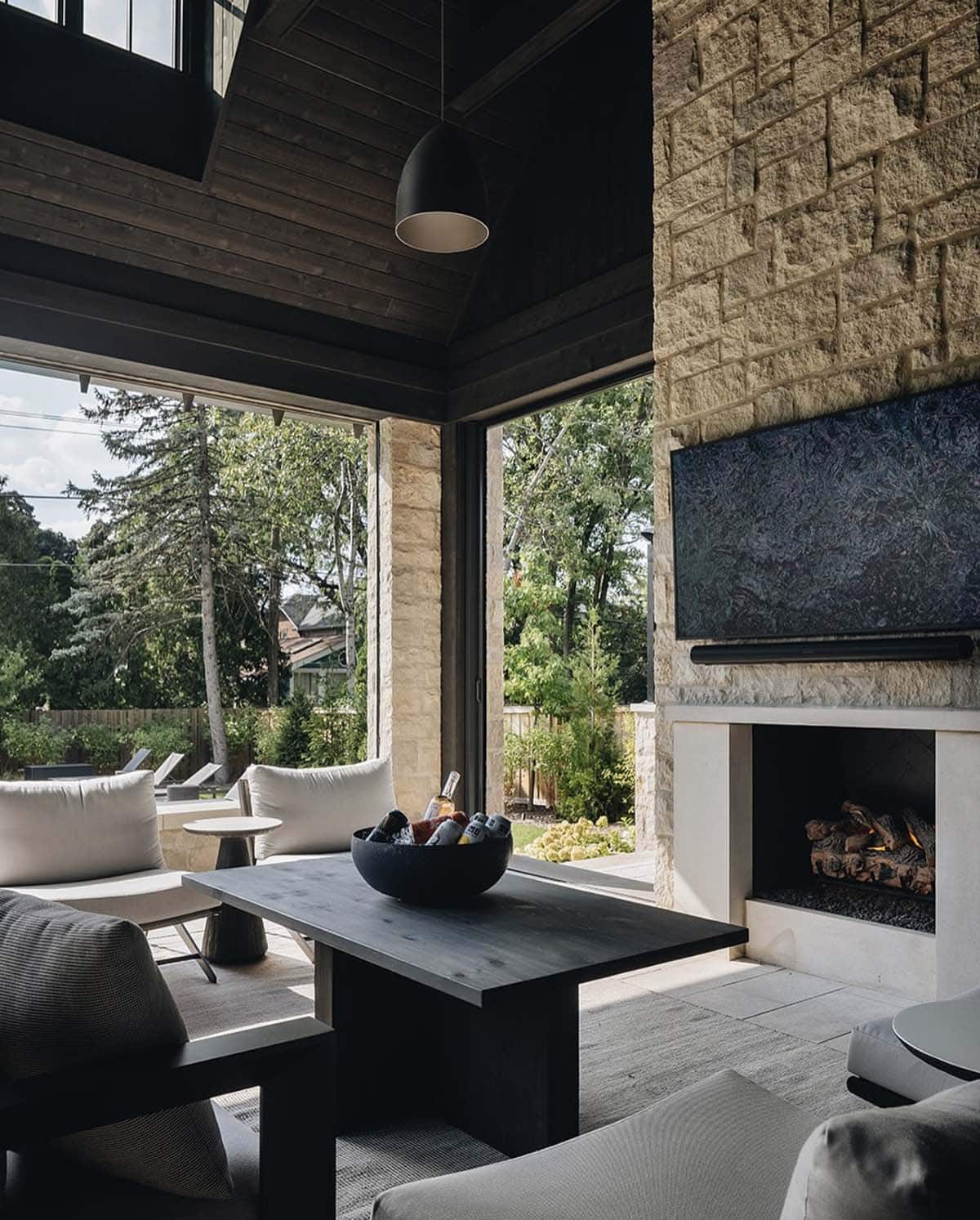 Transitional Style Covered Porch with a fireplace