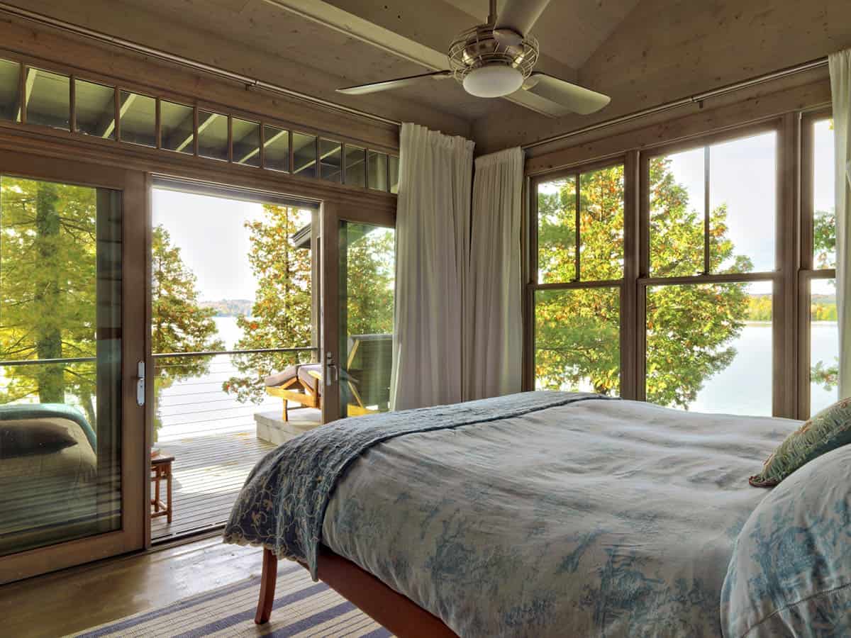rustic bedroom with french doors leading out to a balcony