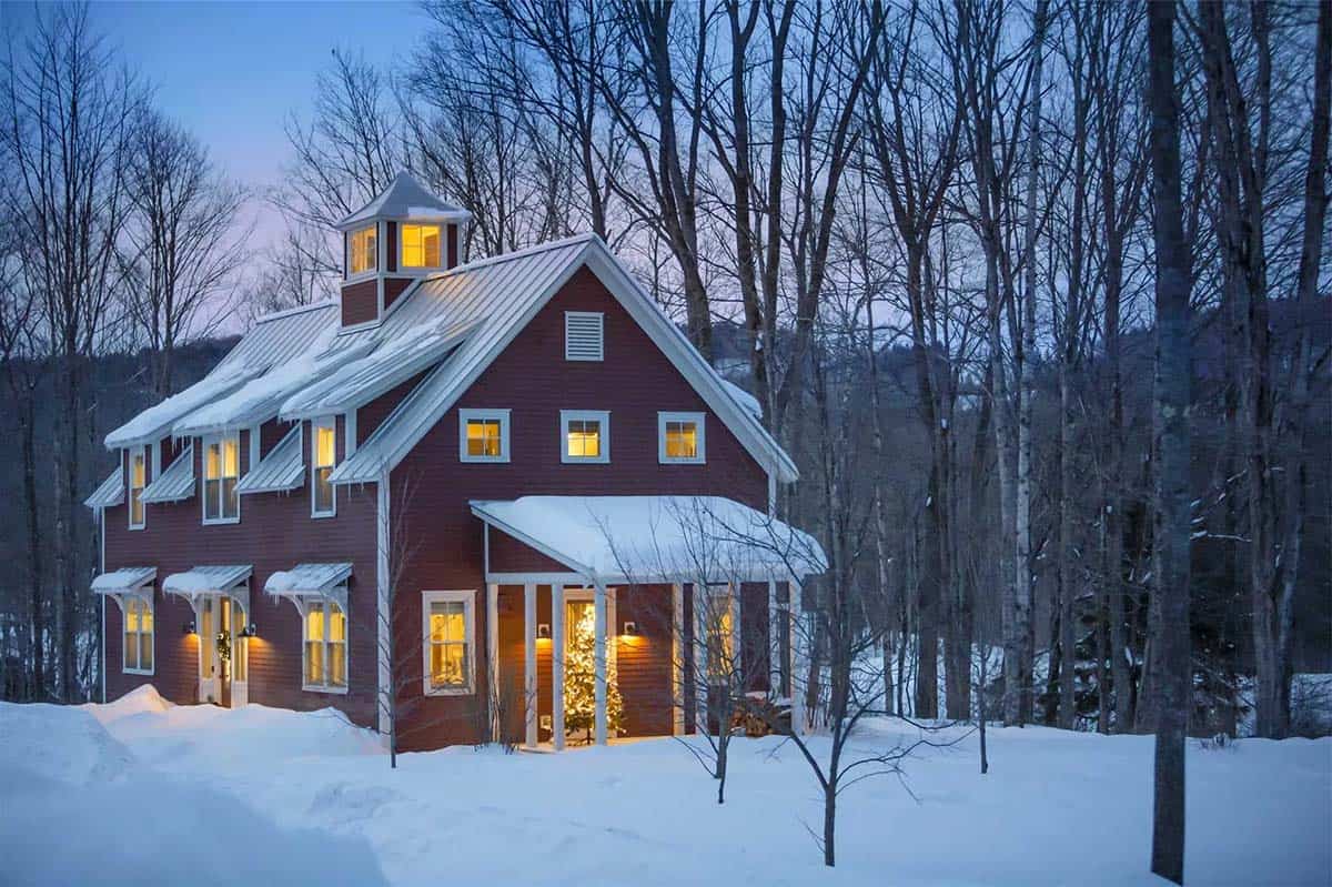 barn style house exterior with snow