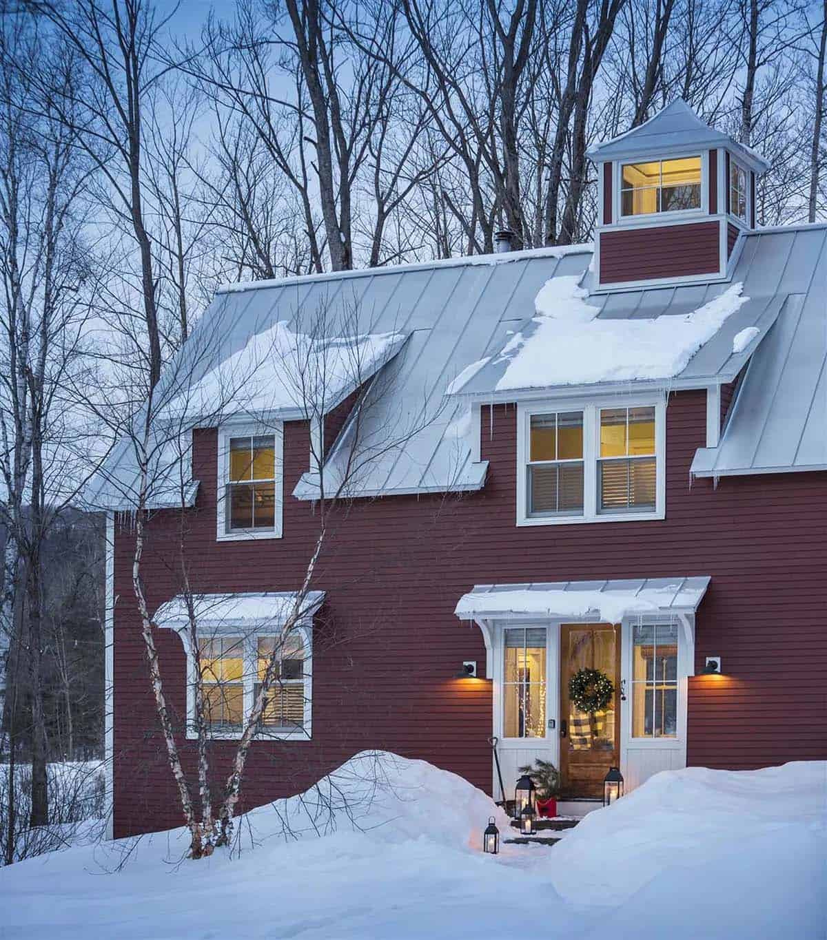 barn style house exterior with snow