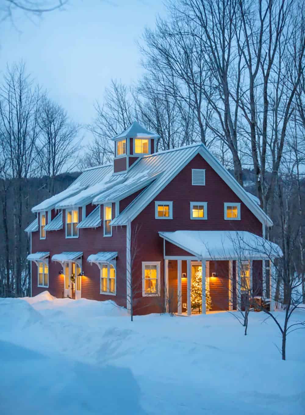 barn style house exterior with snow
