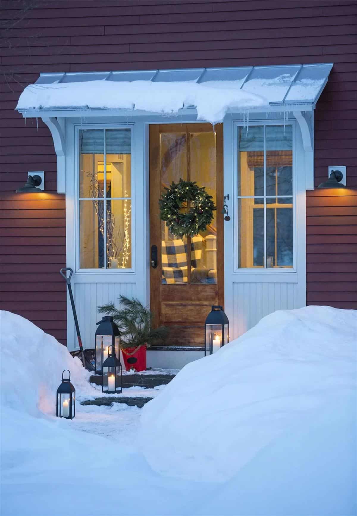 barn style house exterior with snow