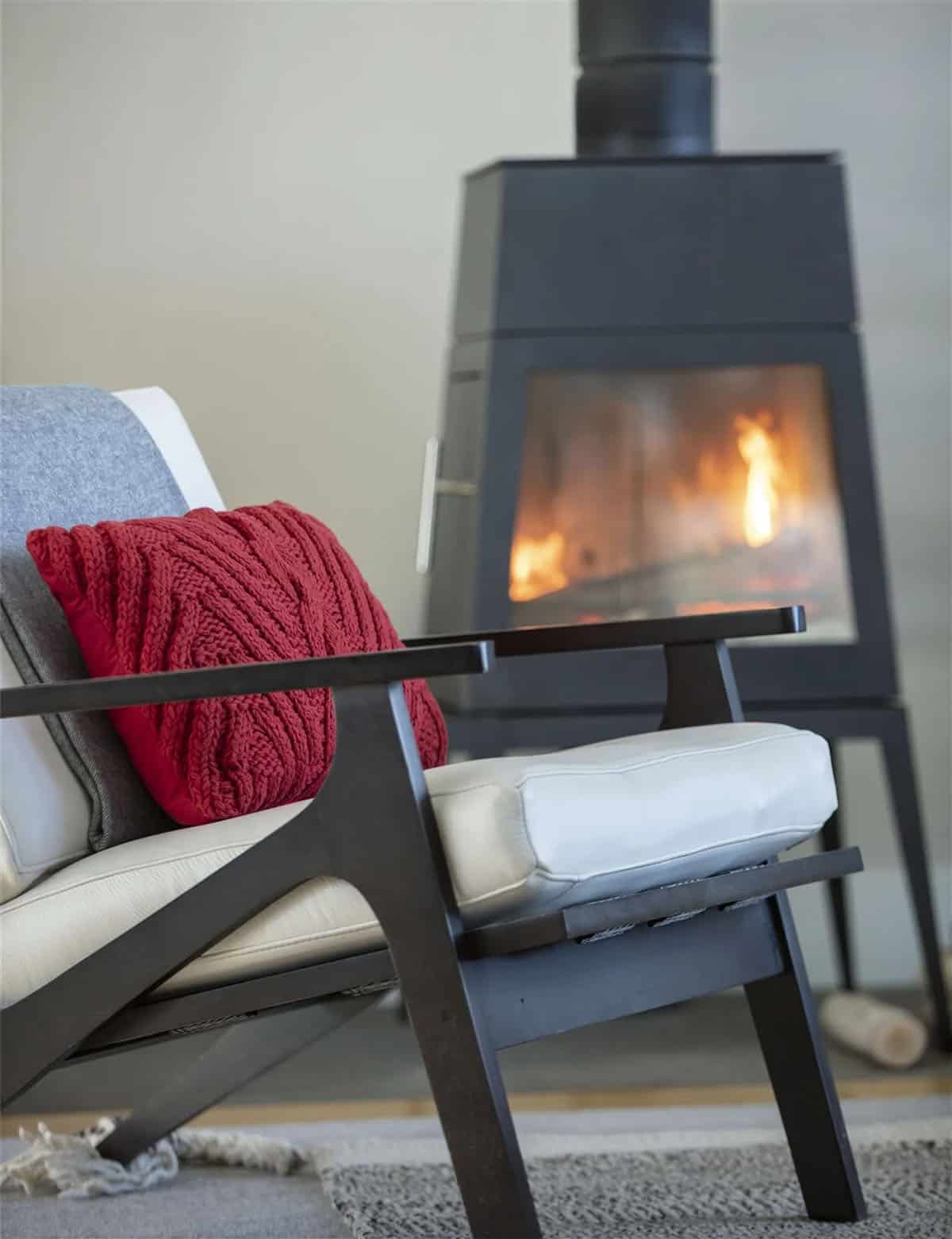 farmhouse style kiving room with a fire stove