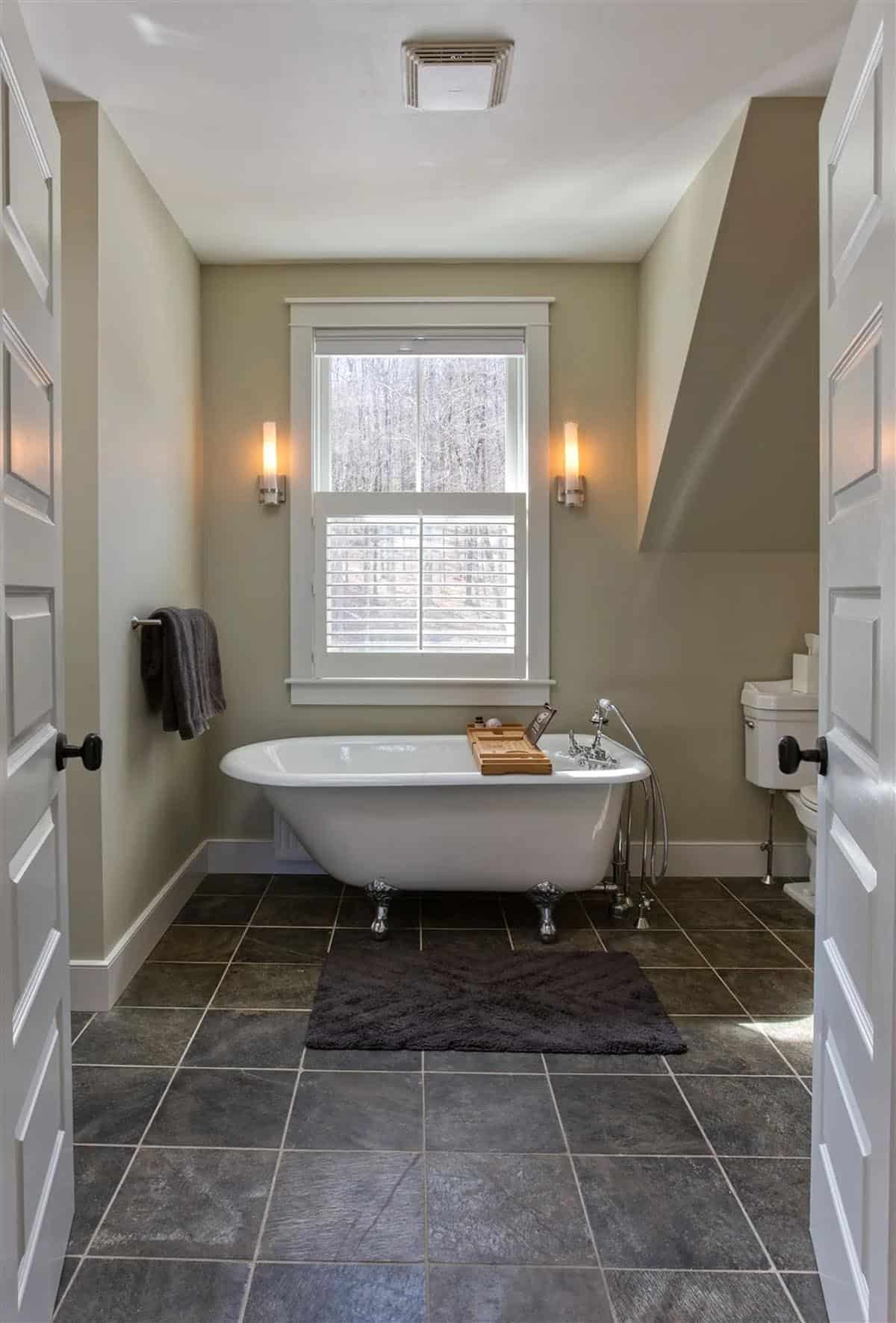 farmhouse style bathroom with a freestanding tub