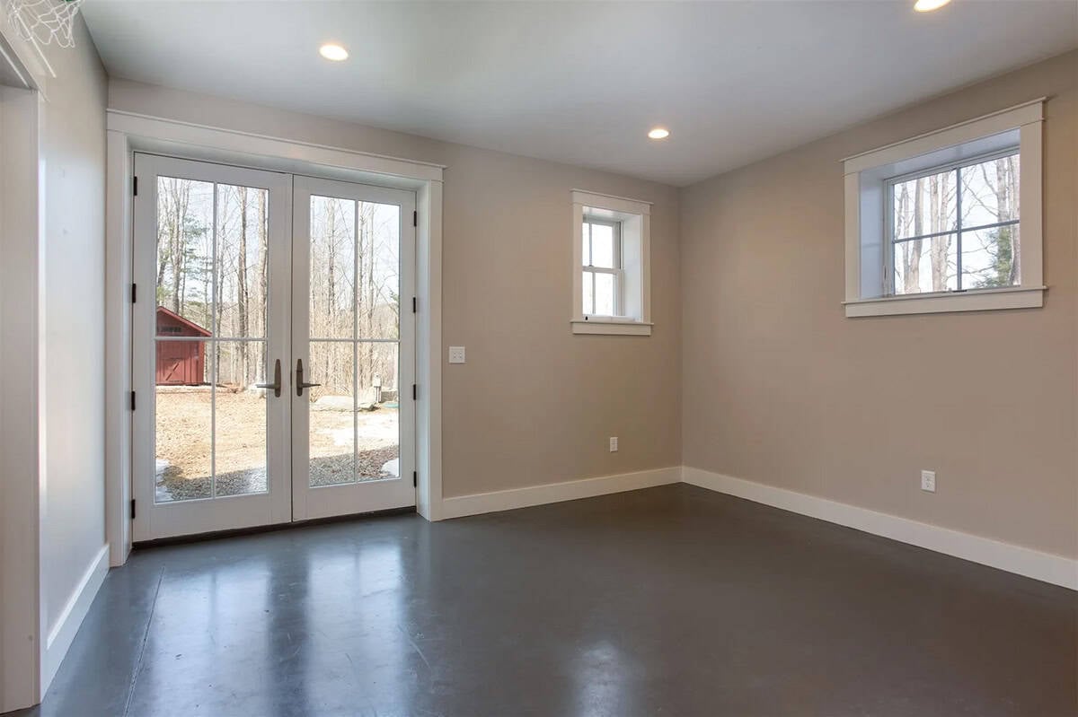 farmhouse style basement with French doors leading to the backyard