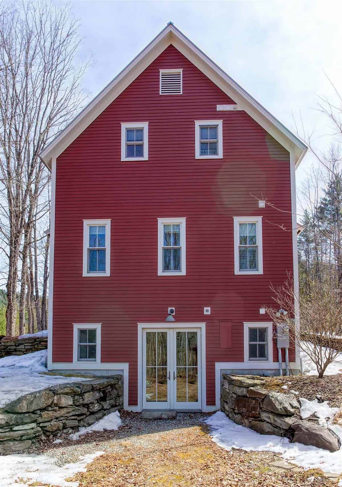 barn style house exterior with snow