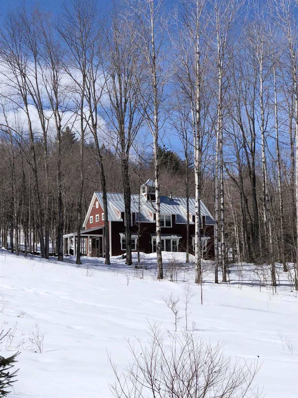 barn style house exterior with snow