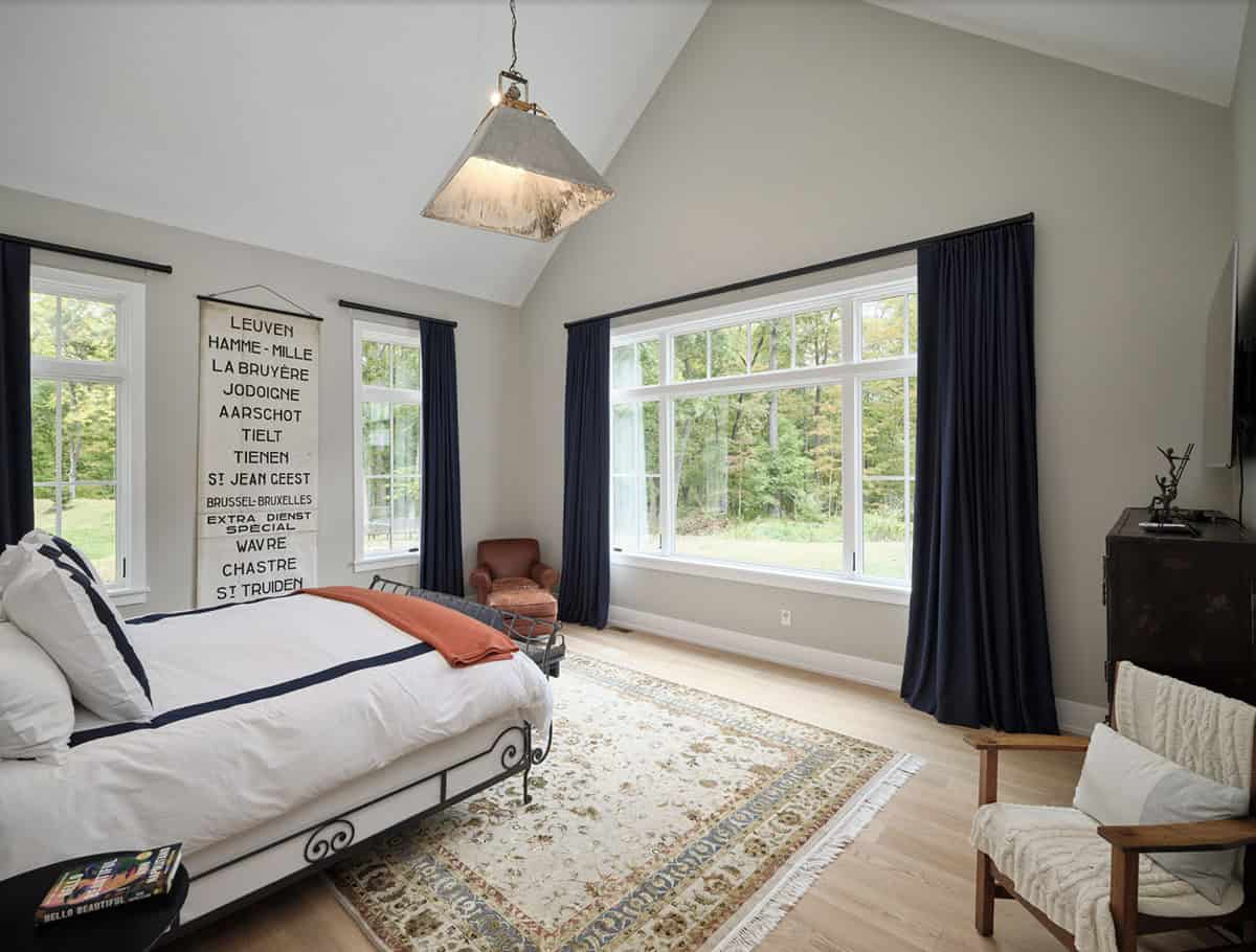 farmhouse style bedroom with a large window