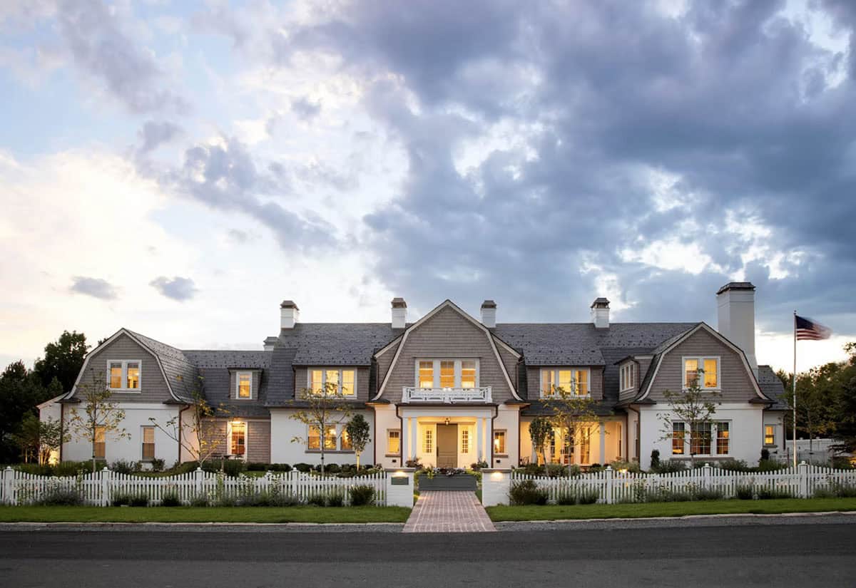 cape-cod inspired home exterior with a gambrel roof