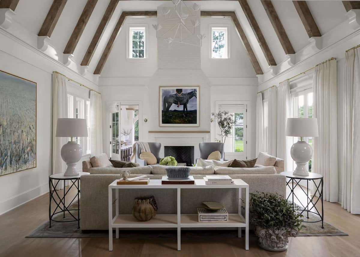 coastal style living room with a vaulted ceiling