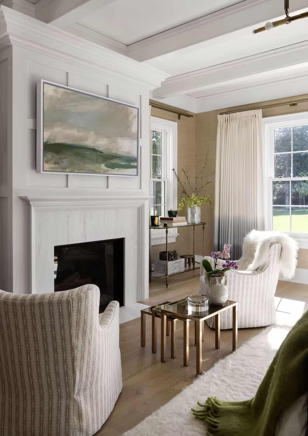 coastal style bedroom with a fireplace