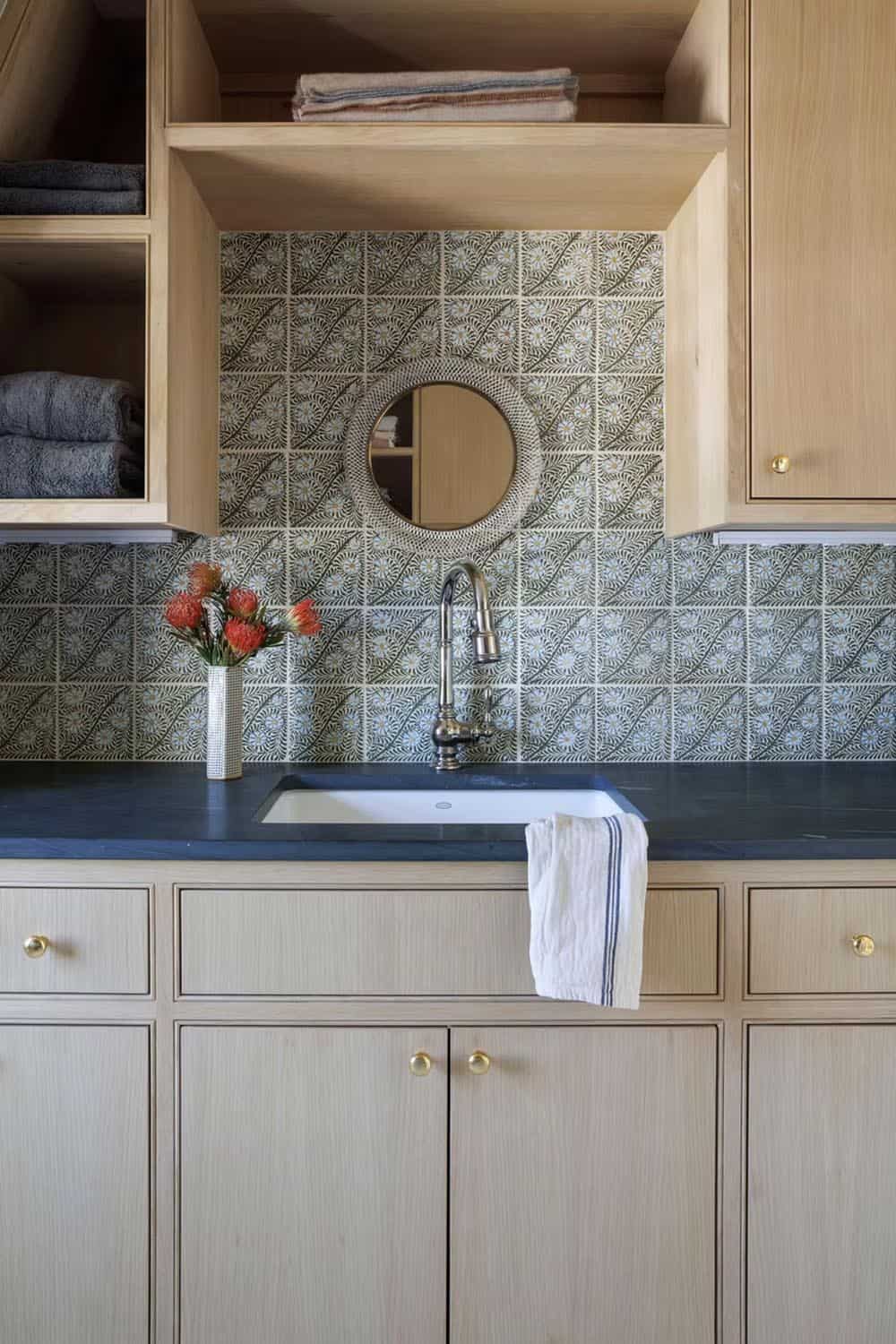 coastal style bedroom with a sink