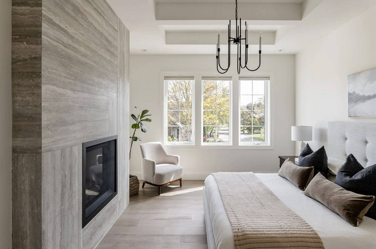 transitional style bedroom with a fireplace