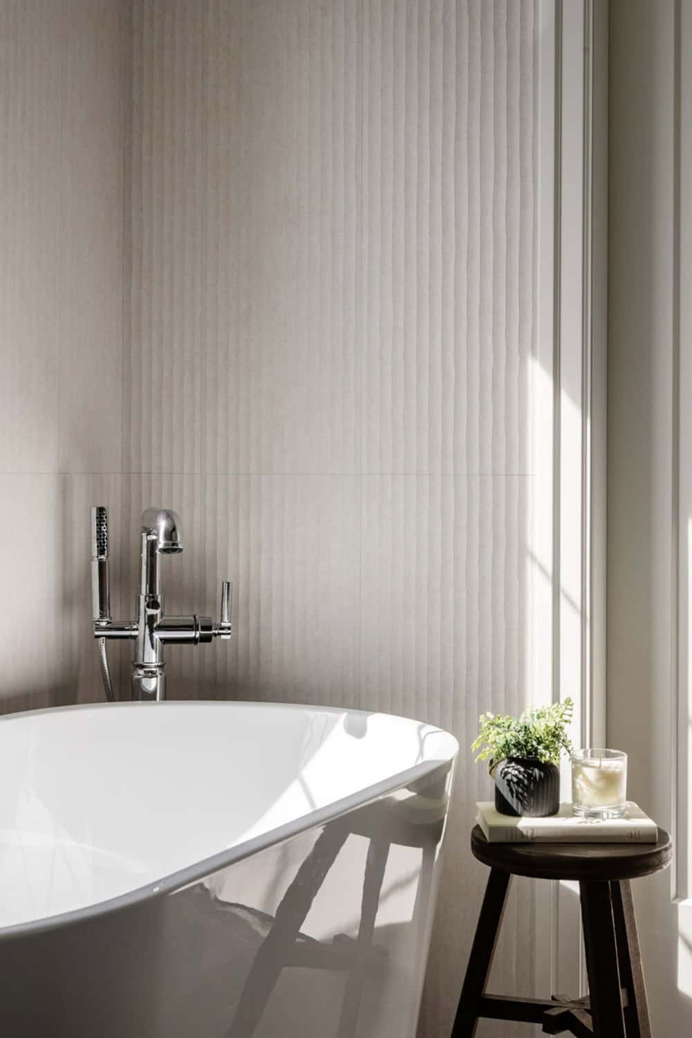 transitional style bathroom with a freestanding tub