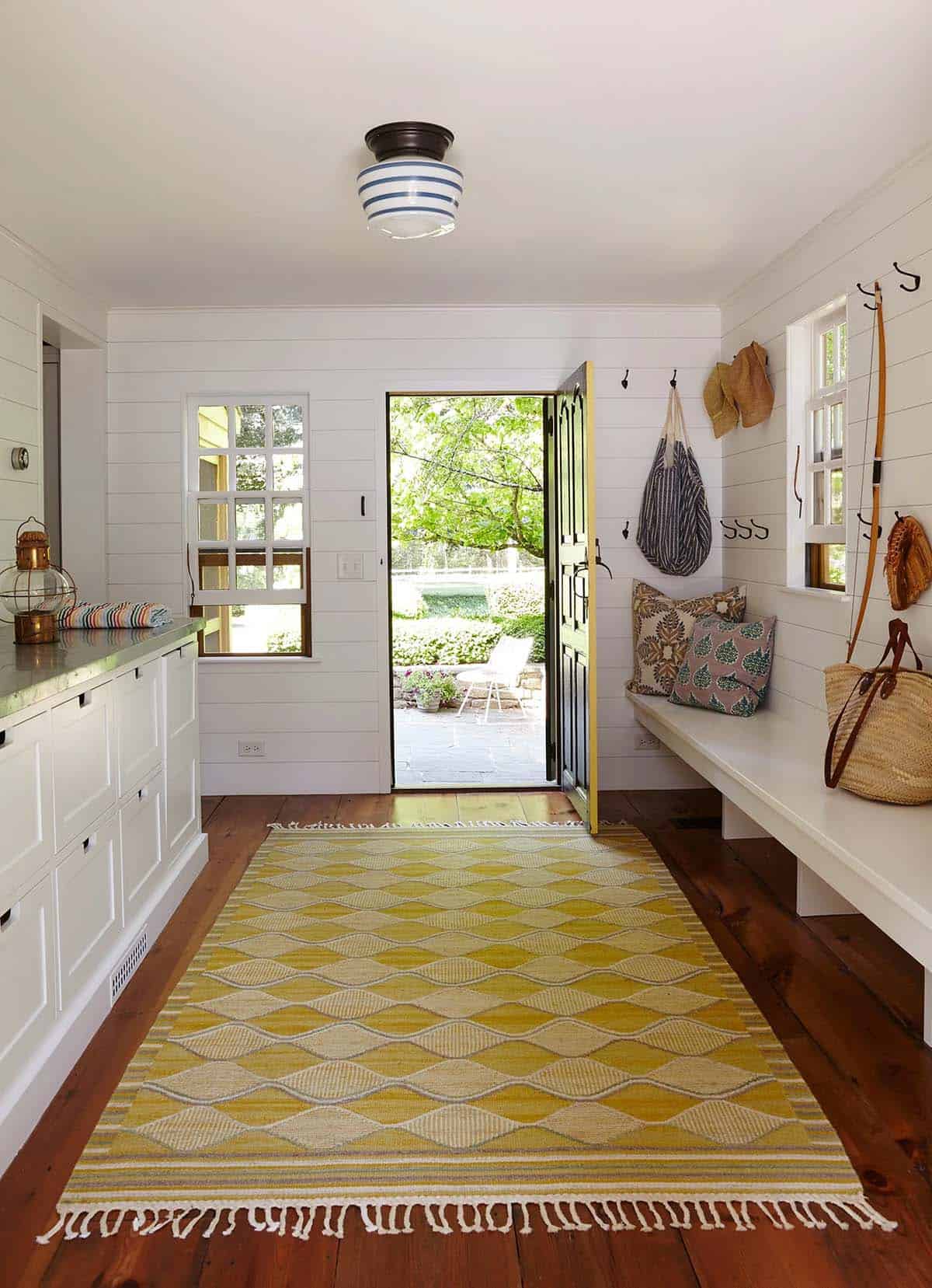 farmhouse style mudroom entry with a built-in bench