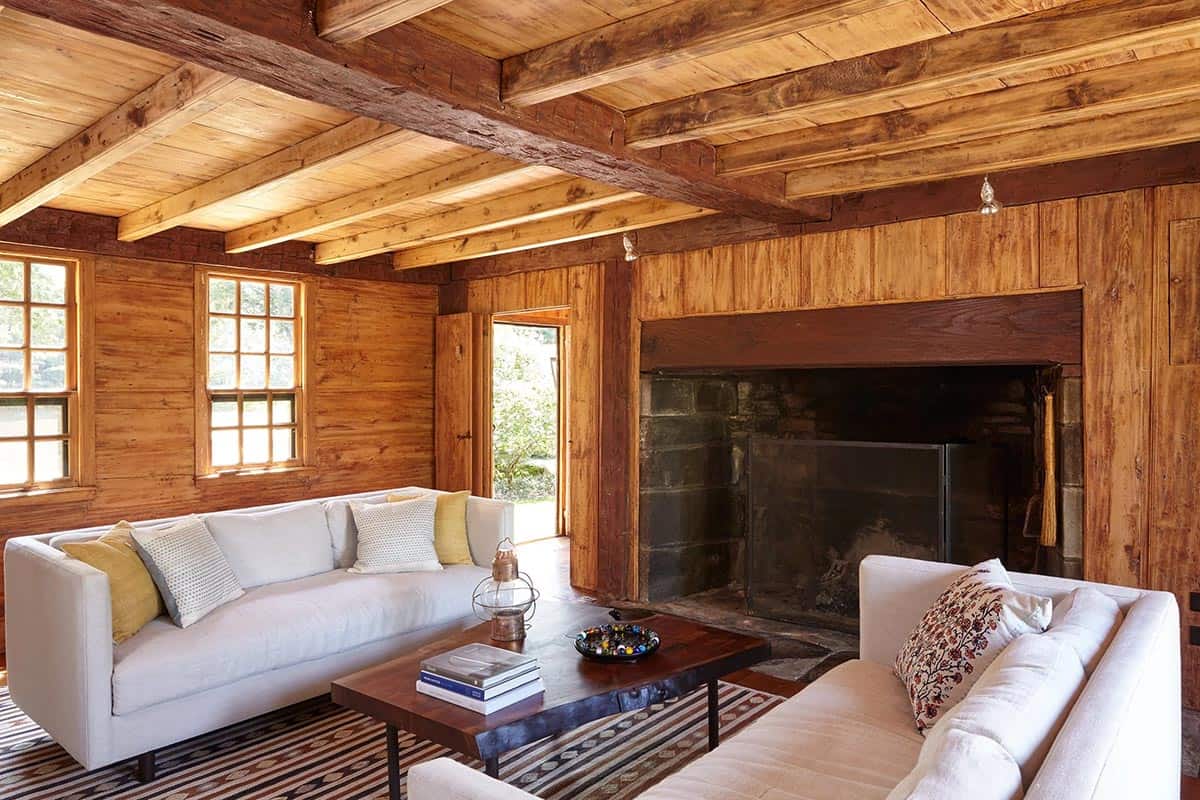 farmhouse style family room with a fireplace