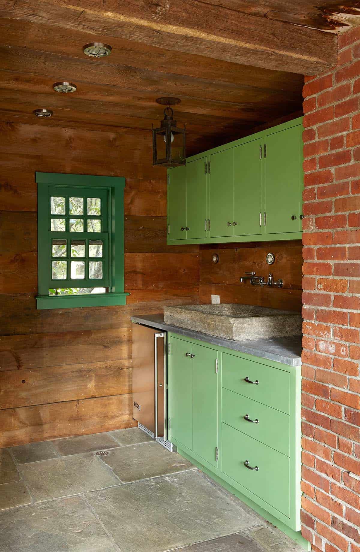 farmhouse style covered outdoor kitchen