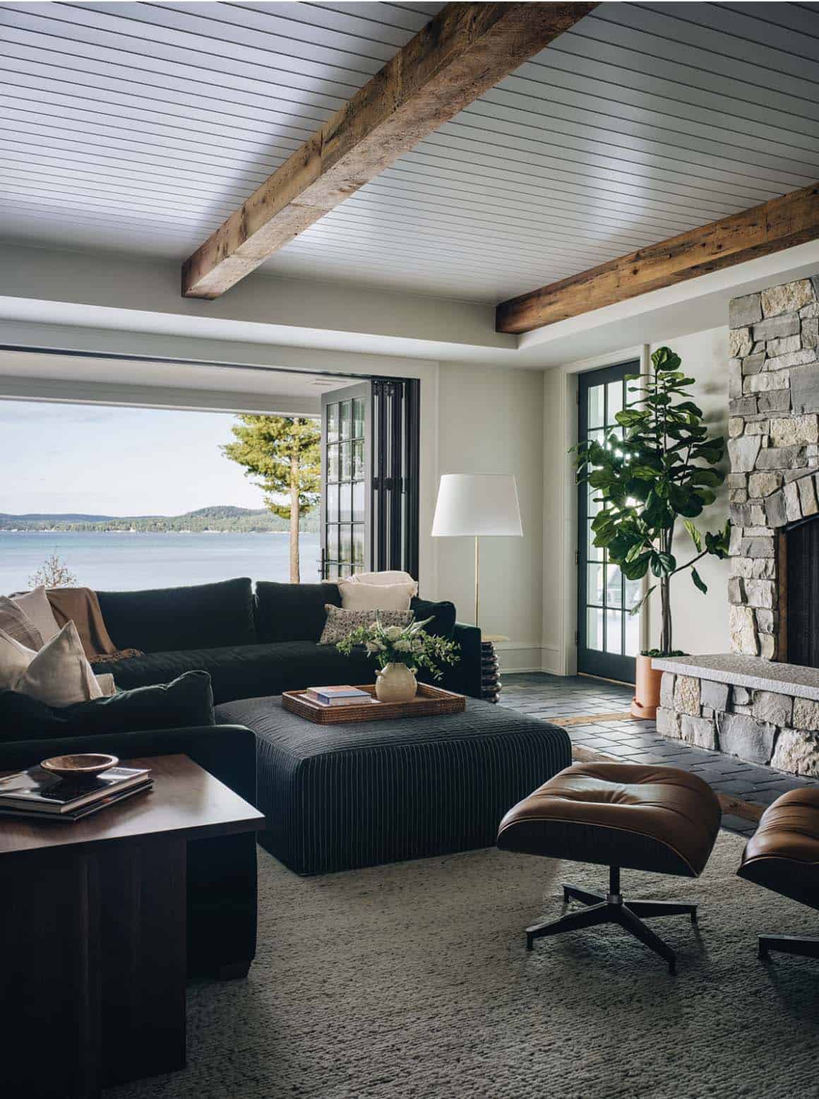contemporary family room with a view of the lake