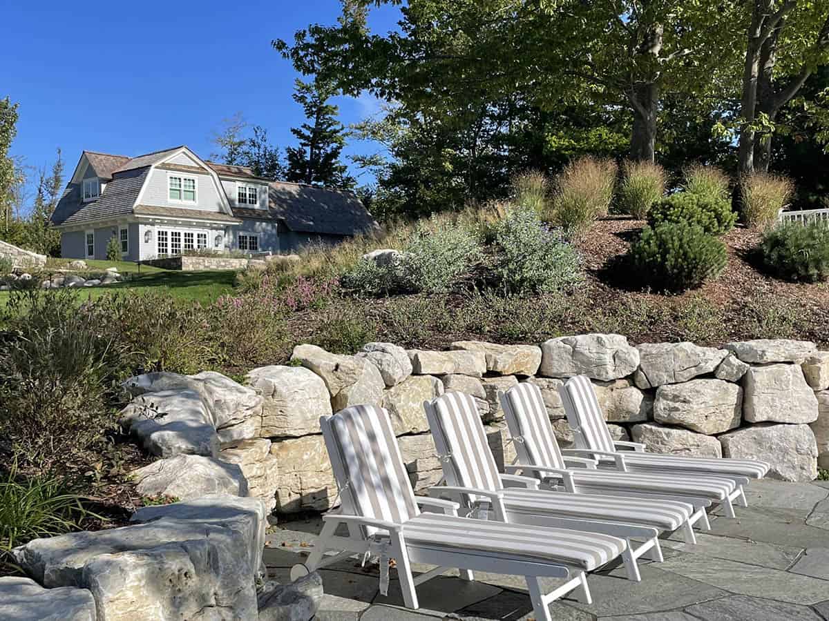 contemporary guest house exterior patio with lounge chairs