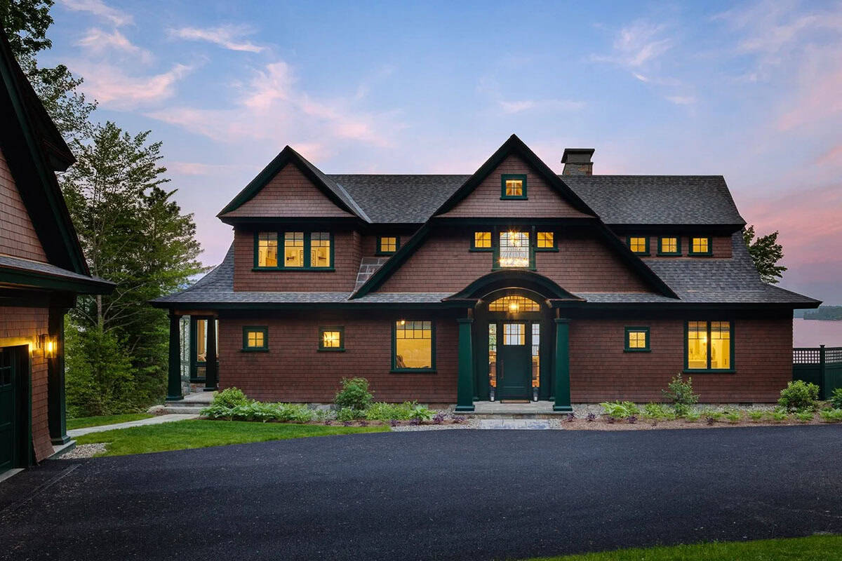 contemporary lake house exterior at dusk