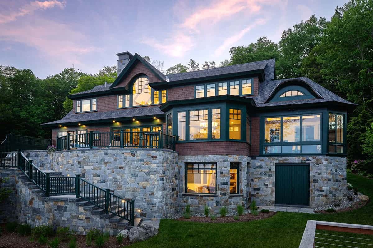 contemporary lake house exterior at dusk