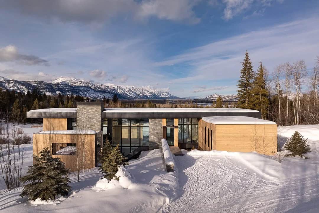contemporary mountain house exterior with snow