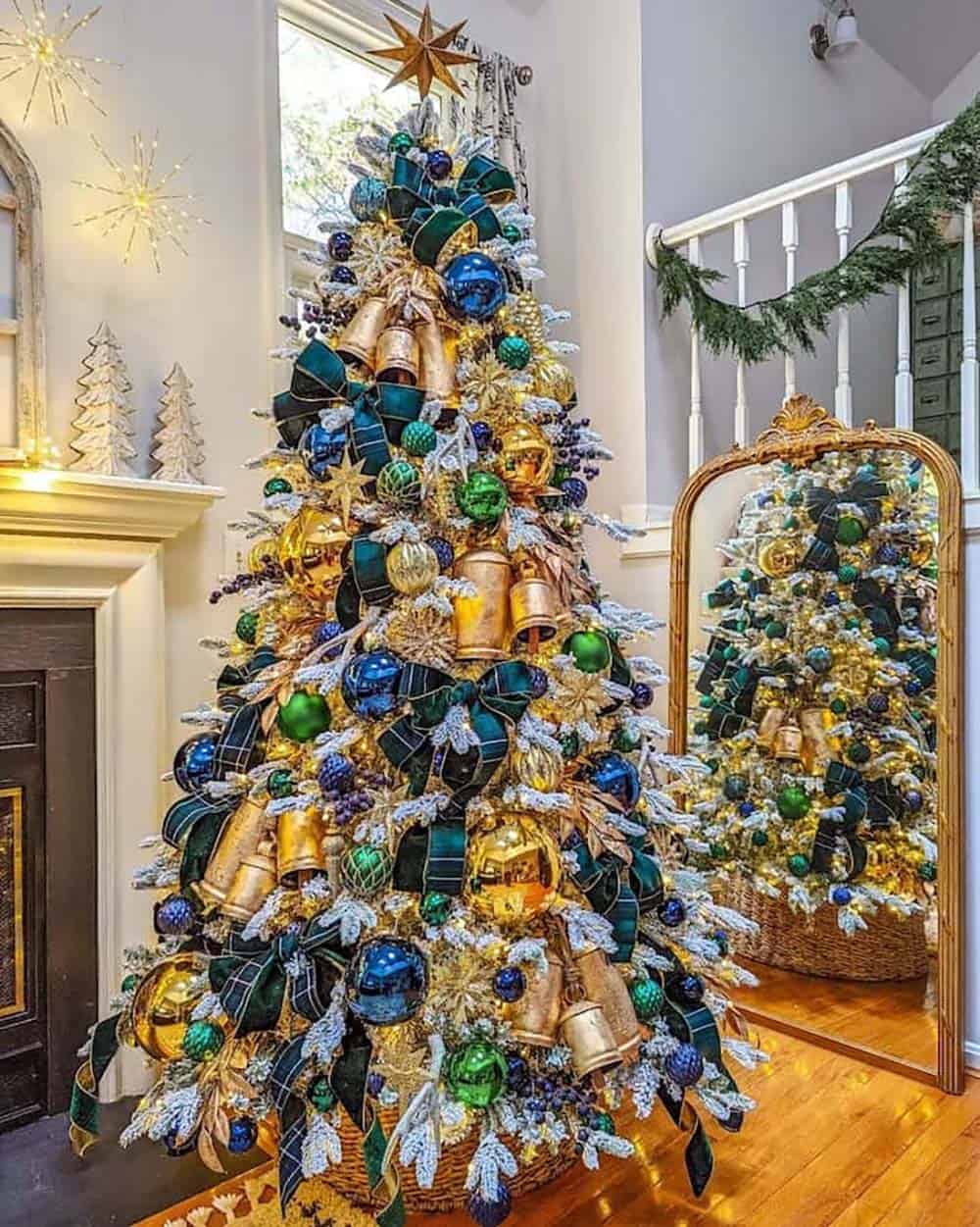 elegant Christmas tree with blue, gold and green decorations 