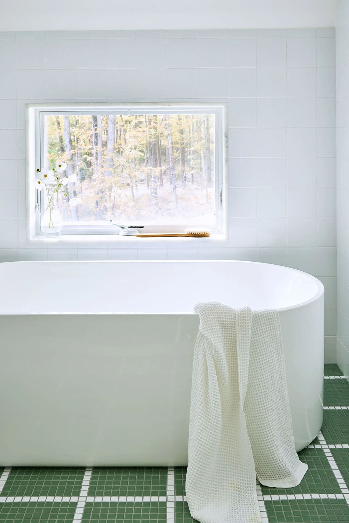 farmhouse style bathroom with a freestanding tub