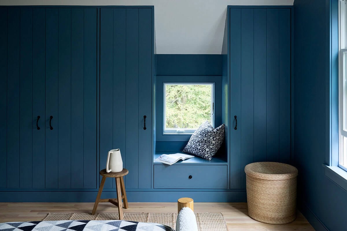 farmhouse style bedroom with built-in closet and window seating