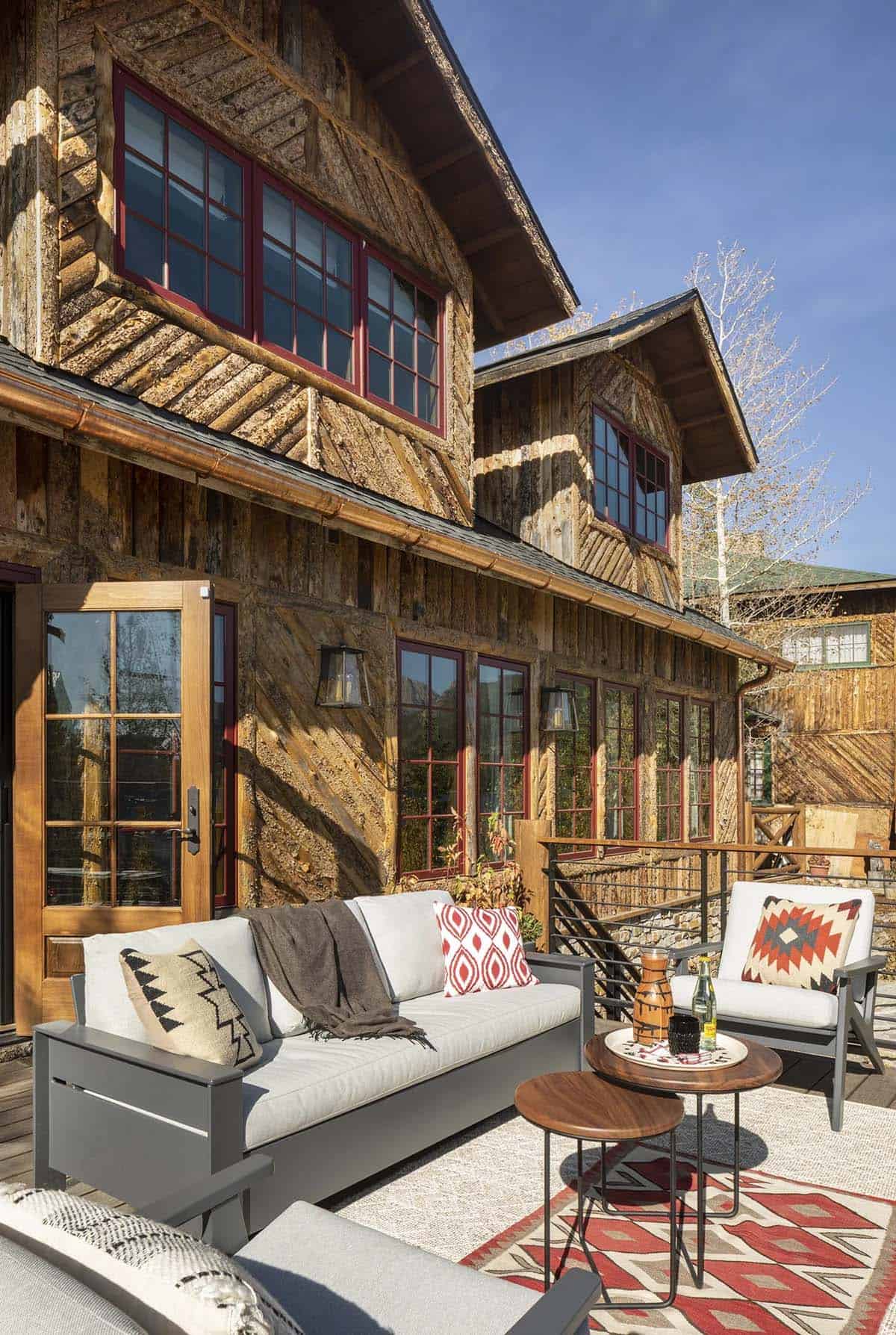 rustic lake house exterior patio with outdoor furniture