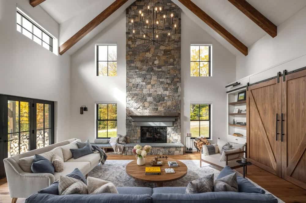 farmhouse style living room with a fireplace