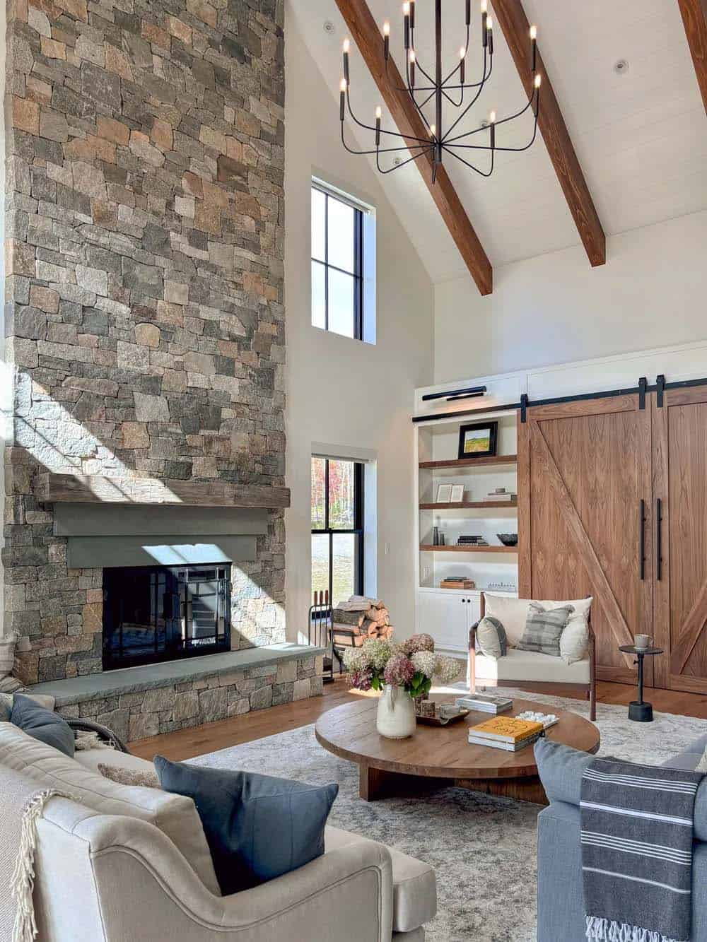 farmhouse style living room with a fireplace